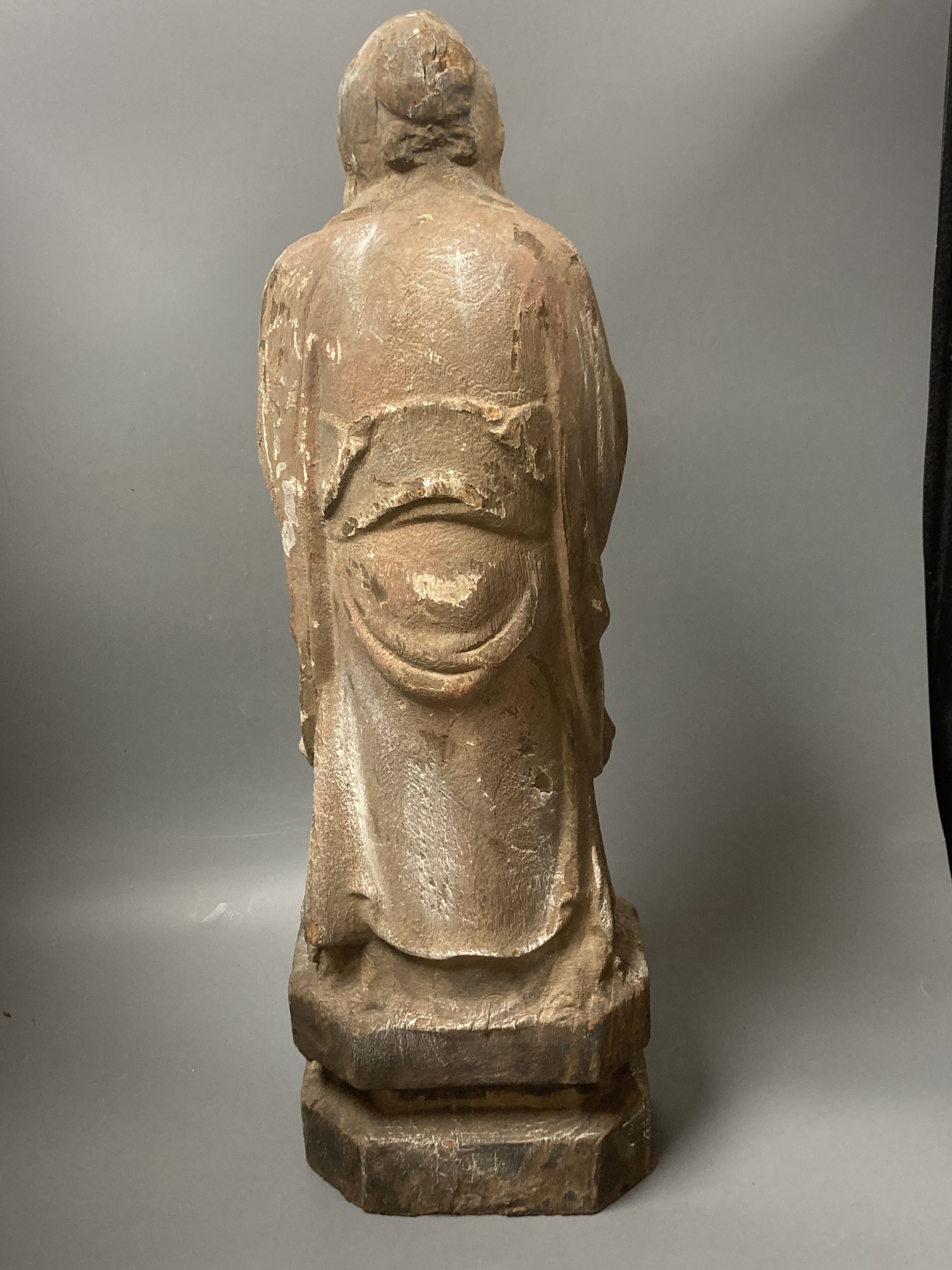 A Chinese carved wood deity, height 60cm